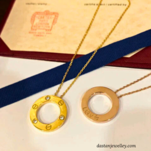 Rose gold love locket displayed on hand