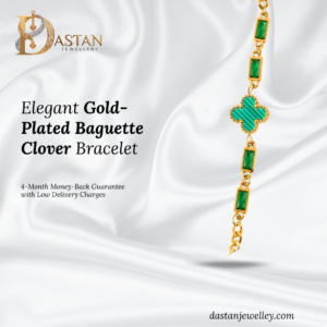 Front view of gold plated baguette clover bracelet with emerald-tone stones.